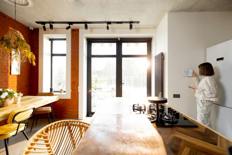 Woman using smart home panel in the living room at home